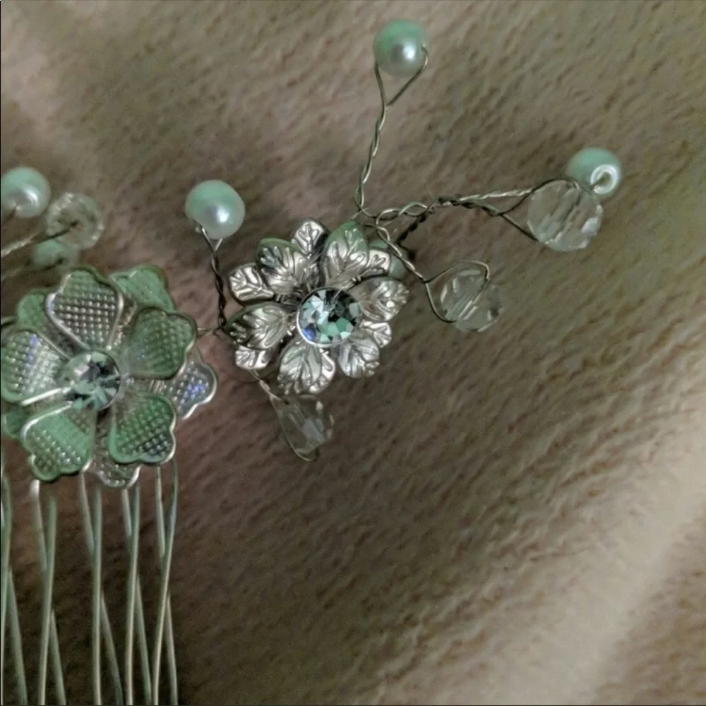 Silver beaded hair piece.